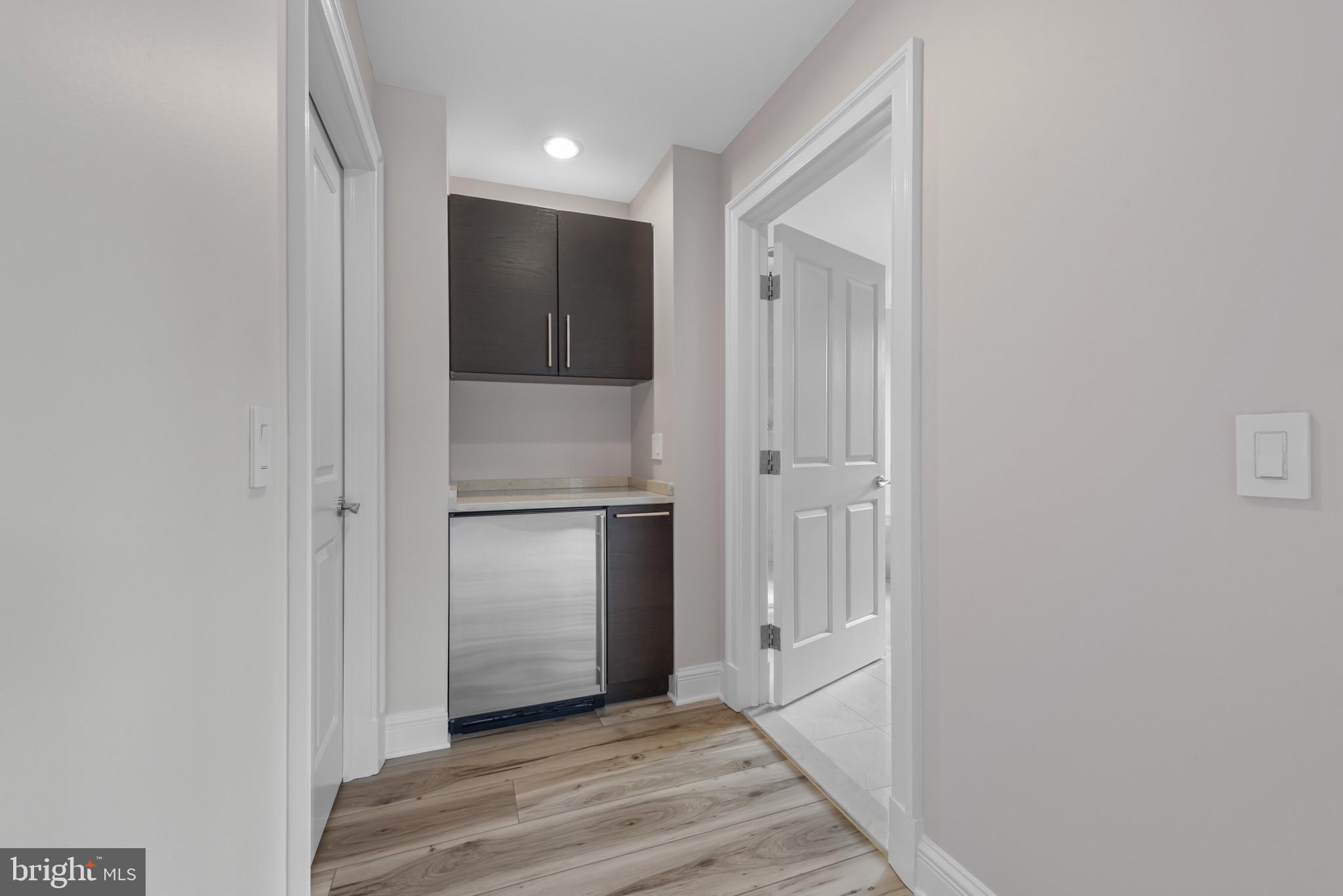 801 Key Highway, Unit 364 Baltimore, MD 21230 - Photo 32 of 54 a view of a hallway with wooden floor and staircase
