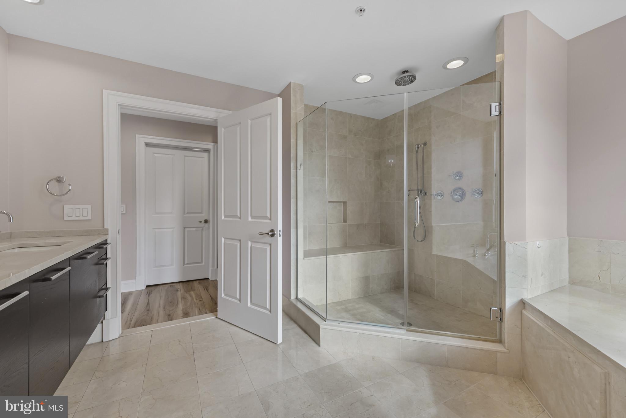 801 Key Highway, Unit 364 Baltimore, MD 21230 - Photo 34 of 54 a bathroom with a shower and a sink