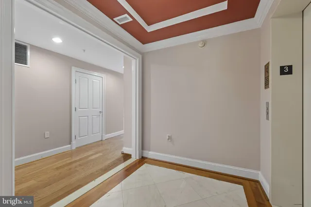 a kitchen with stainless steel appliances granite countertop a sink and a refrigerator