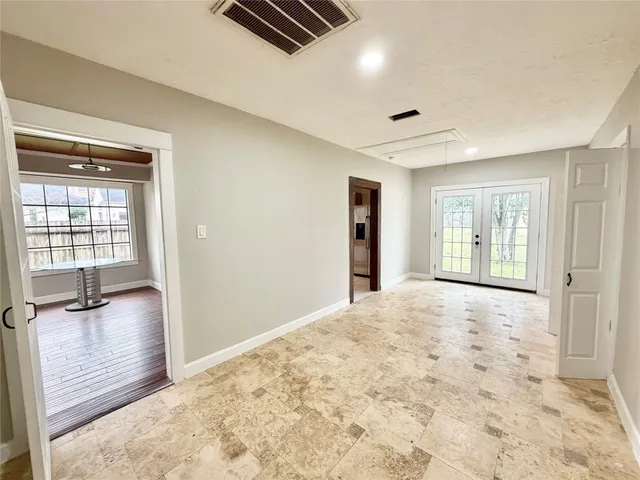 a view of an empty room and window