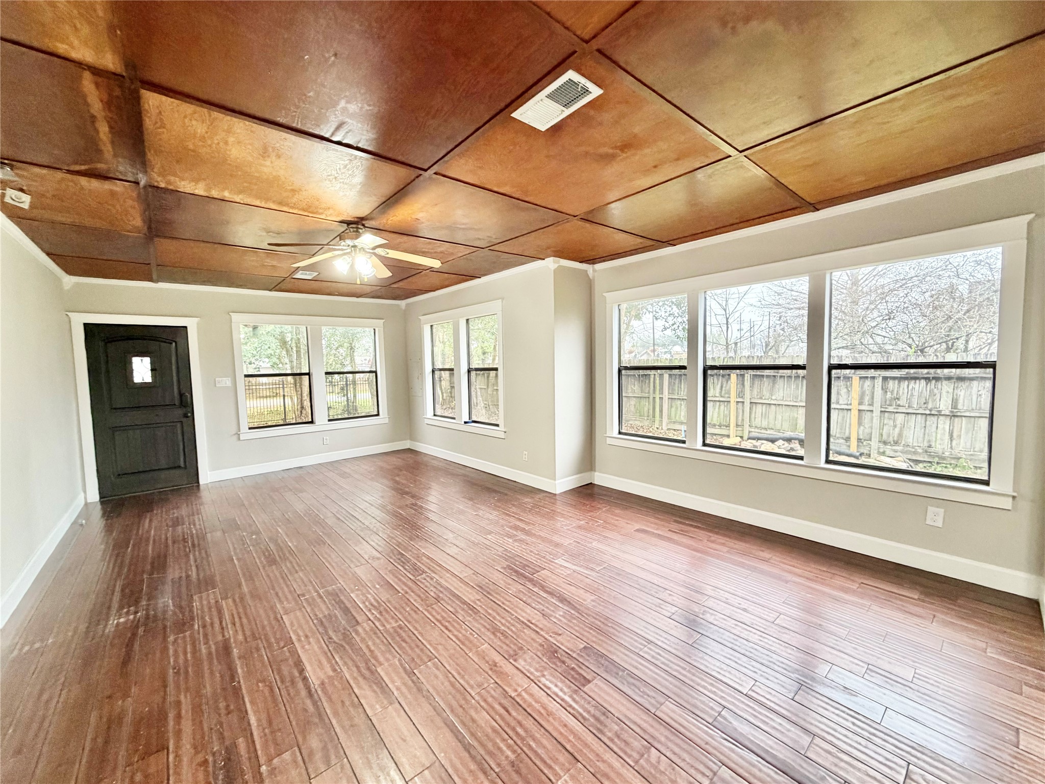 6219 Hamblen Drive Houston, TX 77396 - Photo 3 of 26 Welcoming entryway flows into a bright family room with large windows and elegant wood flooring.