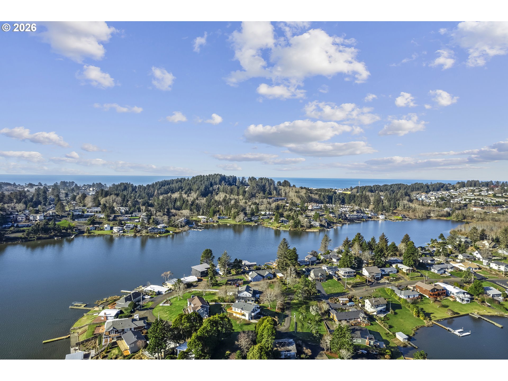 3403 Northeast Johns Loop Neotsu, OR 97364 - Photo 42 of 48 a view of a lake with a city