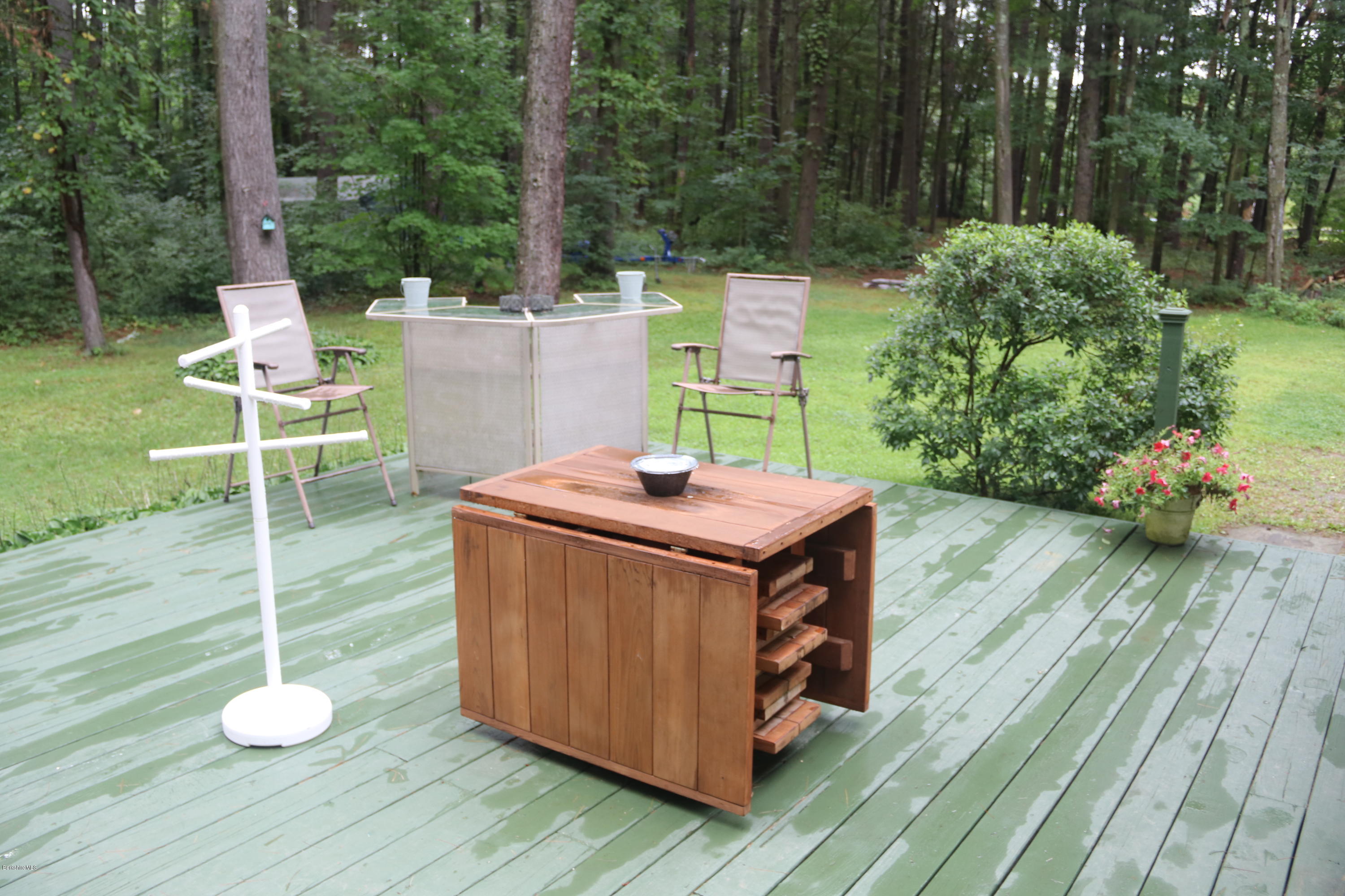 503 Polikoff Road Sheffield, MA 01222 - Photo 9 of 25 a living room with a table and chairs