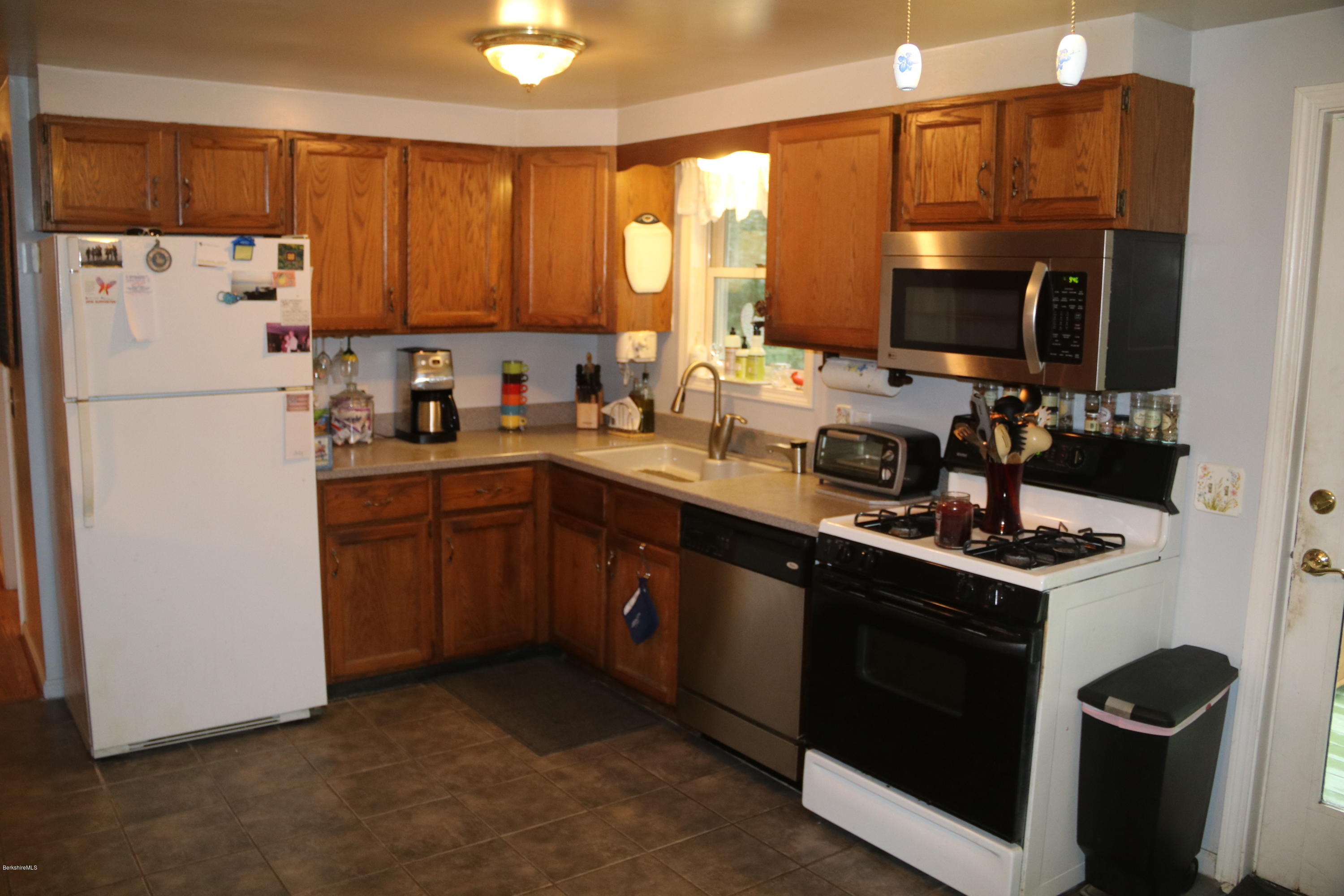 503 Polikoff Road Sheffield, MA 01222 - Photo 10 of 25 a kitchen with a sink a stove and a refrigerator