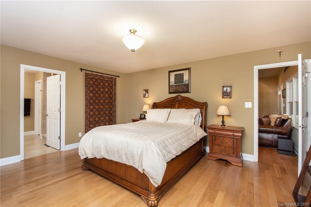 314 Steel Hill Road Lancaster, SC 29720 - Photo 12 of 47 a bedroom with a bed and wooden floor
