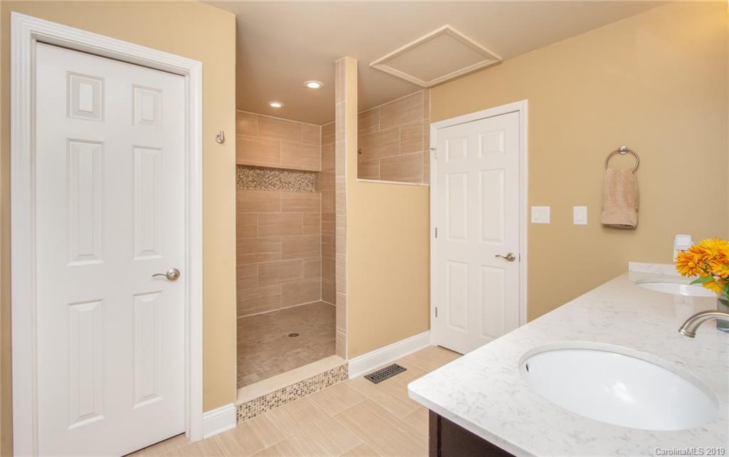 314 Steel Hill Road Lancaster, SC 29720 - Photo 14 of 47 a bathroom with a granite countertop sink and a mirror