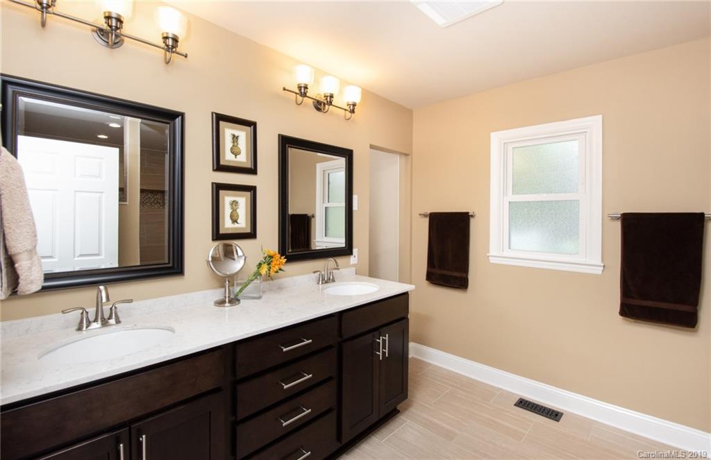 314 Steel Hill Road Lancaster, SC 29720 - Photo 17 of 47 a bathroom with a sink double vanity granite and a mirror