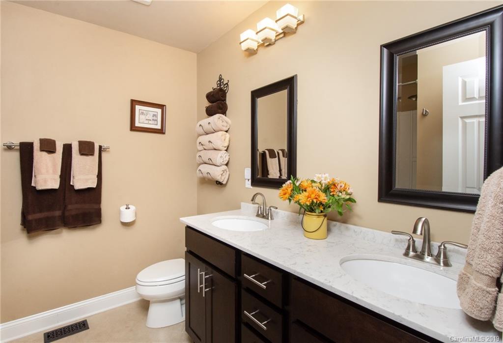 314 Steel Hill Road Lancaster, SC 29720 - Photo 20 of 47 a bathroom with a granite countertop sink vanity mirror and toilet