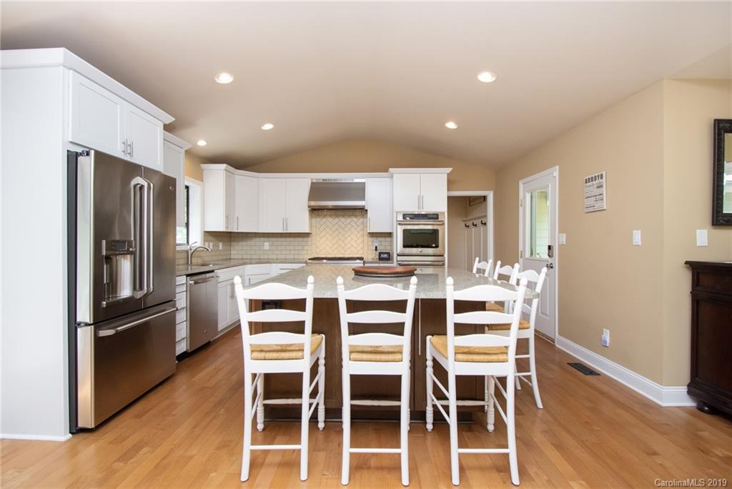 314 Steel Hill Road Lancaster, SC 29720 - Photo 21 of 47 a kitchen with a refrigerator and a stove top oven