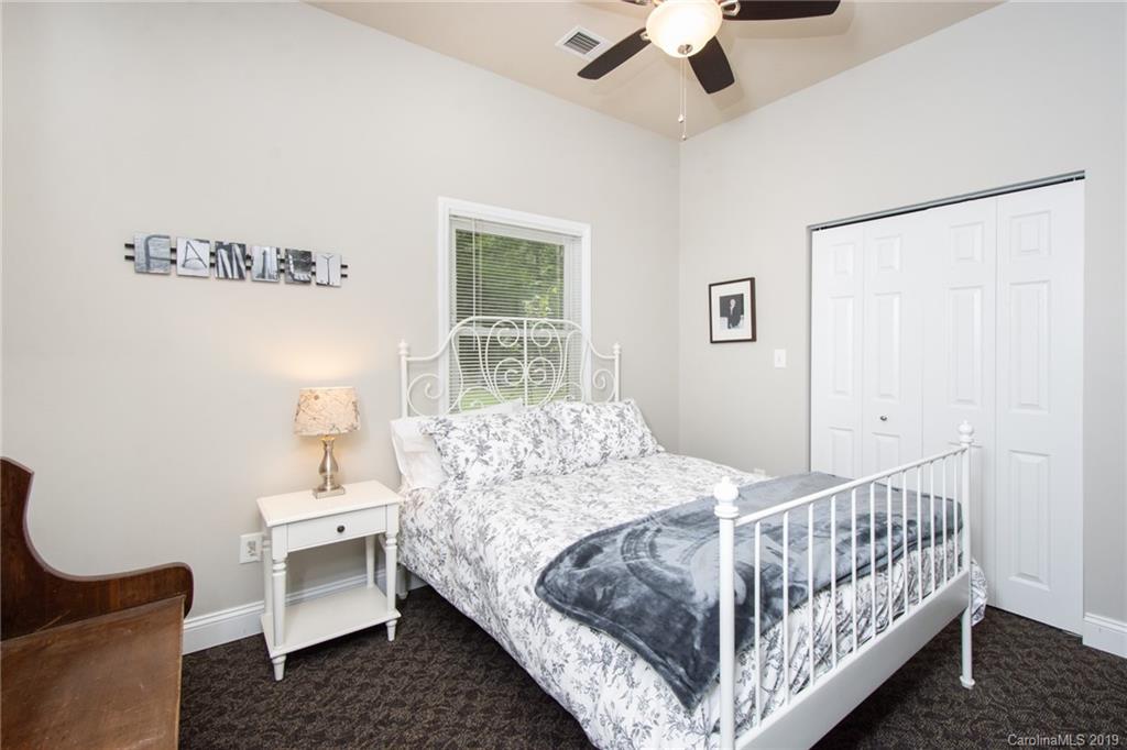 314 Steel Hill Road Lancaster, SC 29720 - Photo 29 of 47 a bedroom with a bed and a table