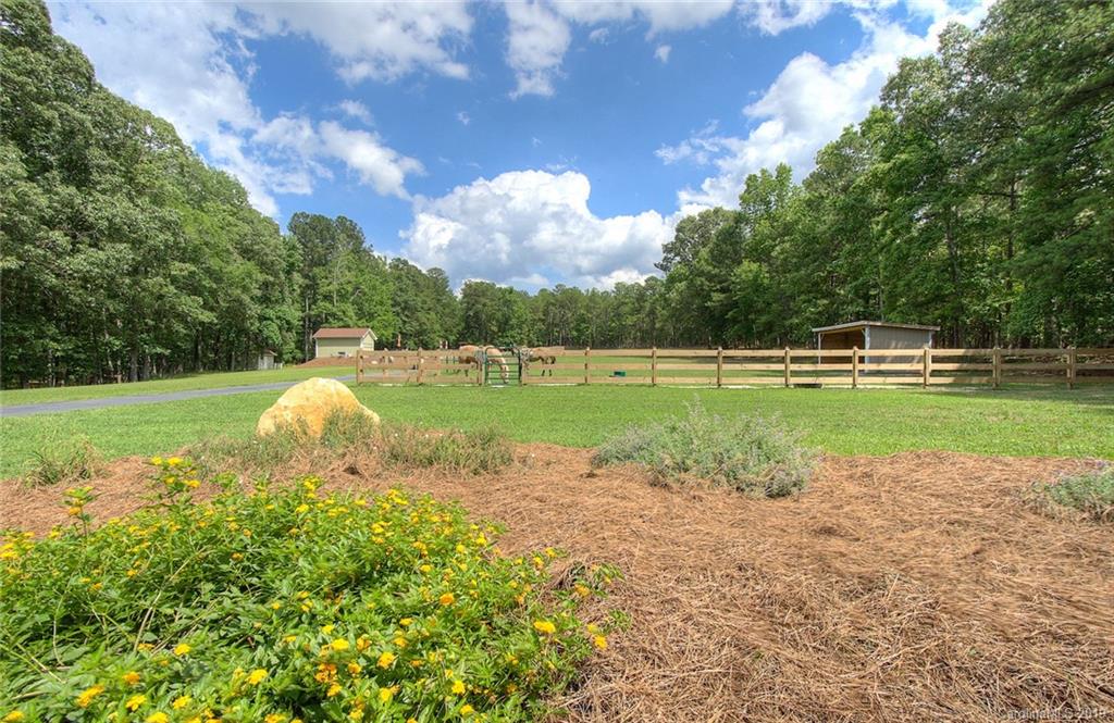 314 Steel Hill Road Lancaster, SC 29720 - Photo 36 of 47 a view of a golf course with a lake