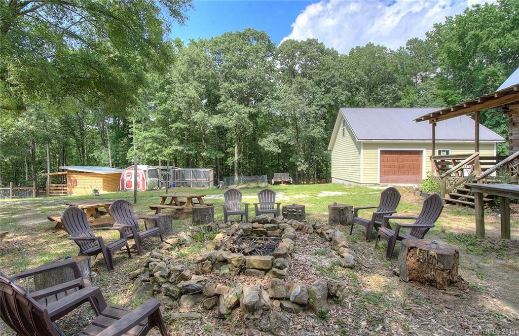 314 Steel Hill Road Lancaster, SC 29720 - Photo 38 of 47 a view of a patio with table and chairs and potted plants