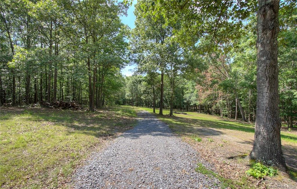 314 Steel Hill Road Lancaster, SC 29720 - Photo 44 of 47 a view of a backyard with large trees
