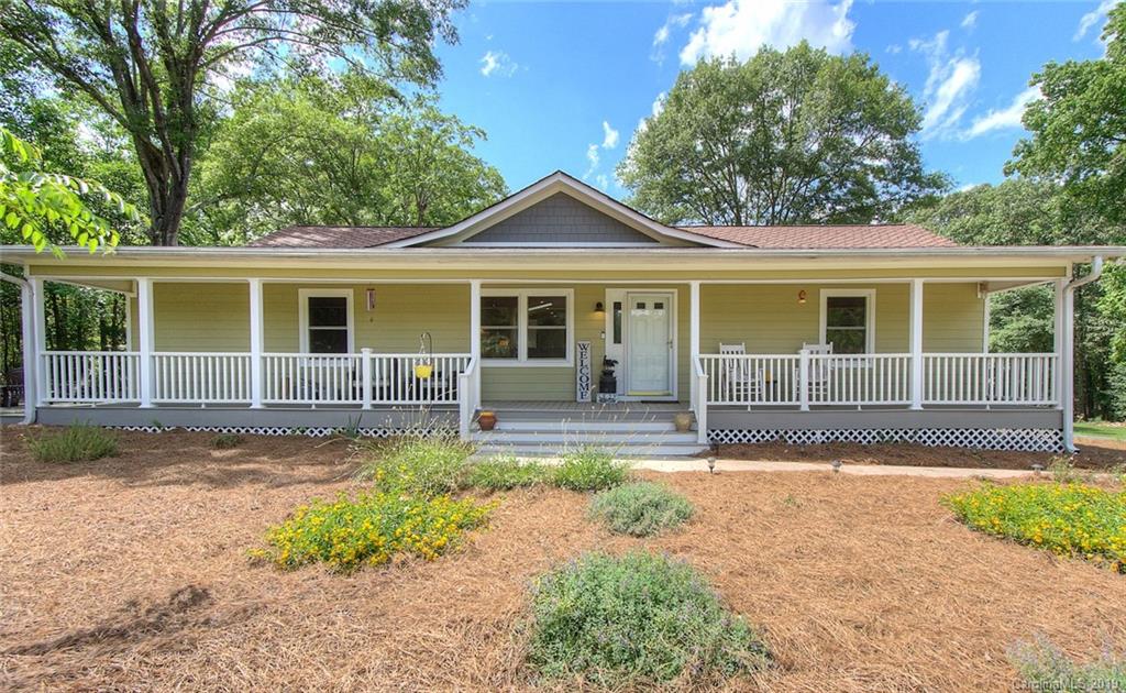 314 Steel Hill Road Lancaster, SC 29720 - Photo 6 of 47 a front view of a house with a yard and garage
