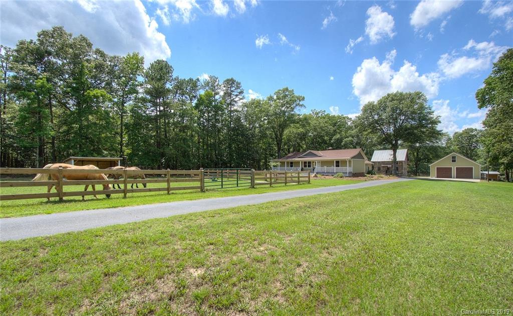 314 Steel Hill Road Lancaster, SC 29720 - Photo 8 of 47 a view of a house with backyard and swimming pool
