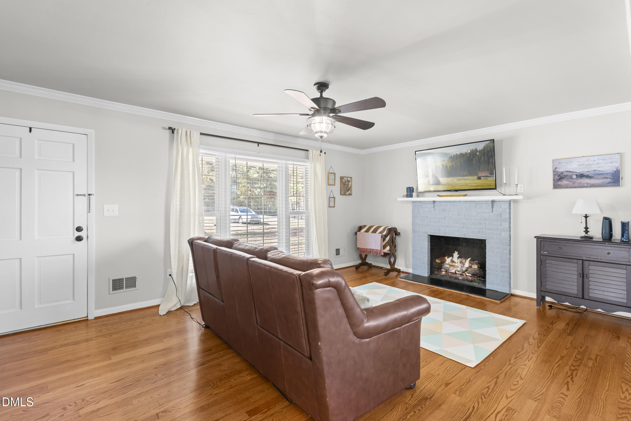3032 Rosinburg Road Zebulon, NC 27597 - Photo 13 of 28 a living room with furniture and a fireplace