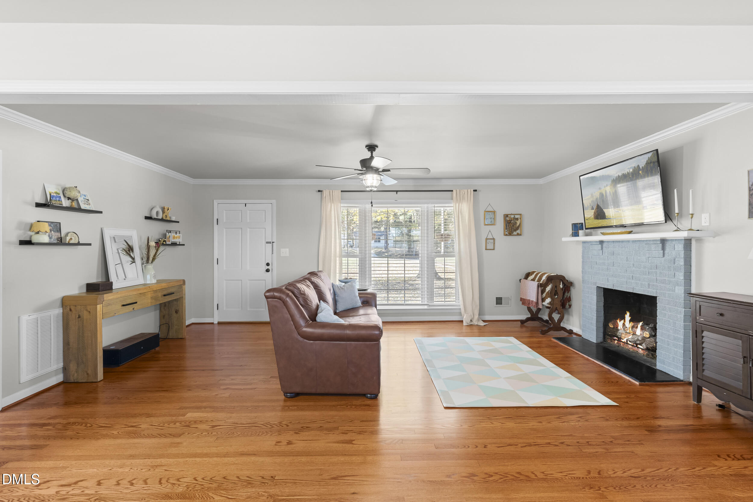 3032 Rosinburg Road Zebulon, NC 27597 - Photo 14 of 28 a living room with furniture and a fireplace