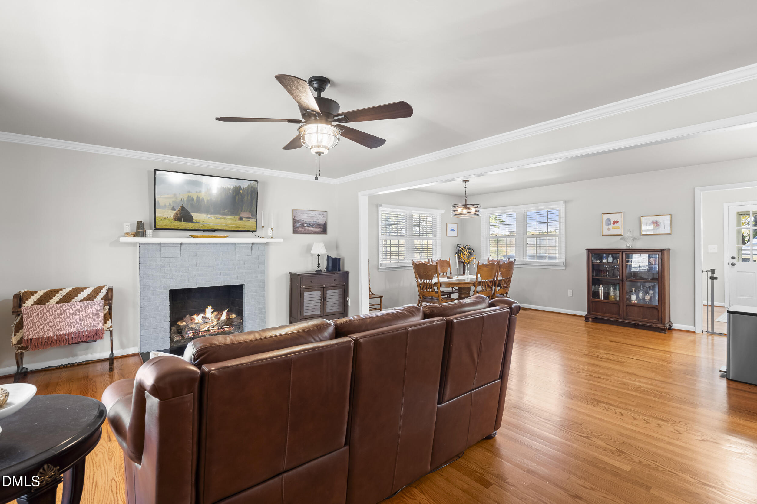 3032 Rosinburg Road Zebulon, NC 27597 - Photo 15 of 28 a living room with furniture fireplace and flat screen tv