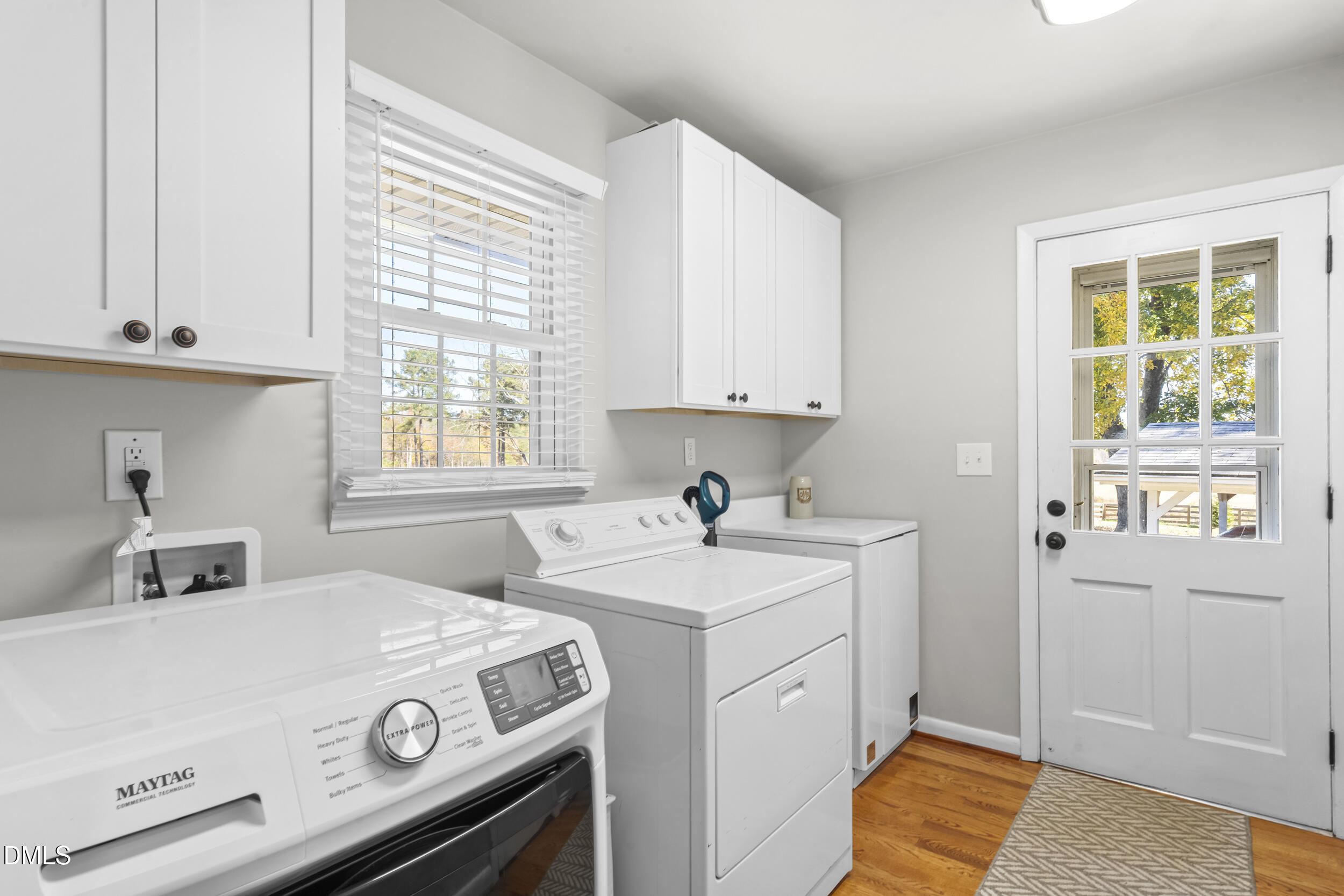 3032 Rosinburg Road Zebulon, NC 27597 - Photo 16 of 28 a utility room with dryer washer and a window