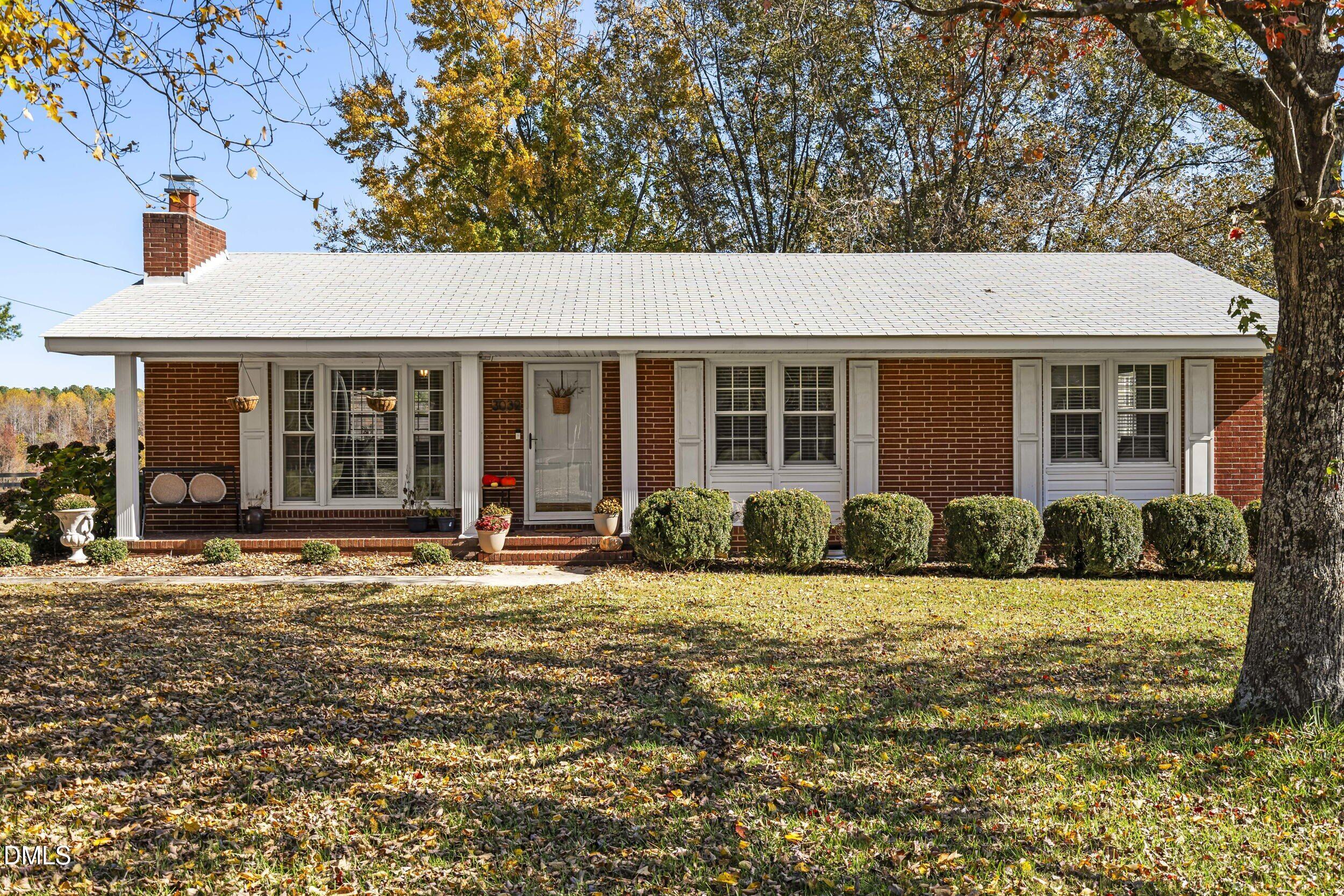 3032 Rosinburg Road Zebulon, NC 27597 - Photo 2 of 28 a front view of a house with a yard