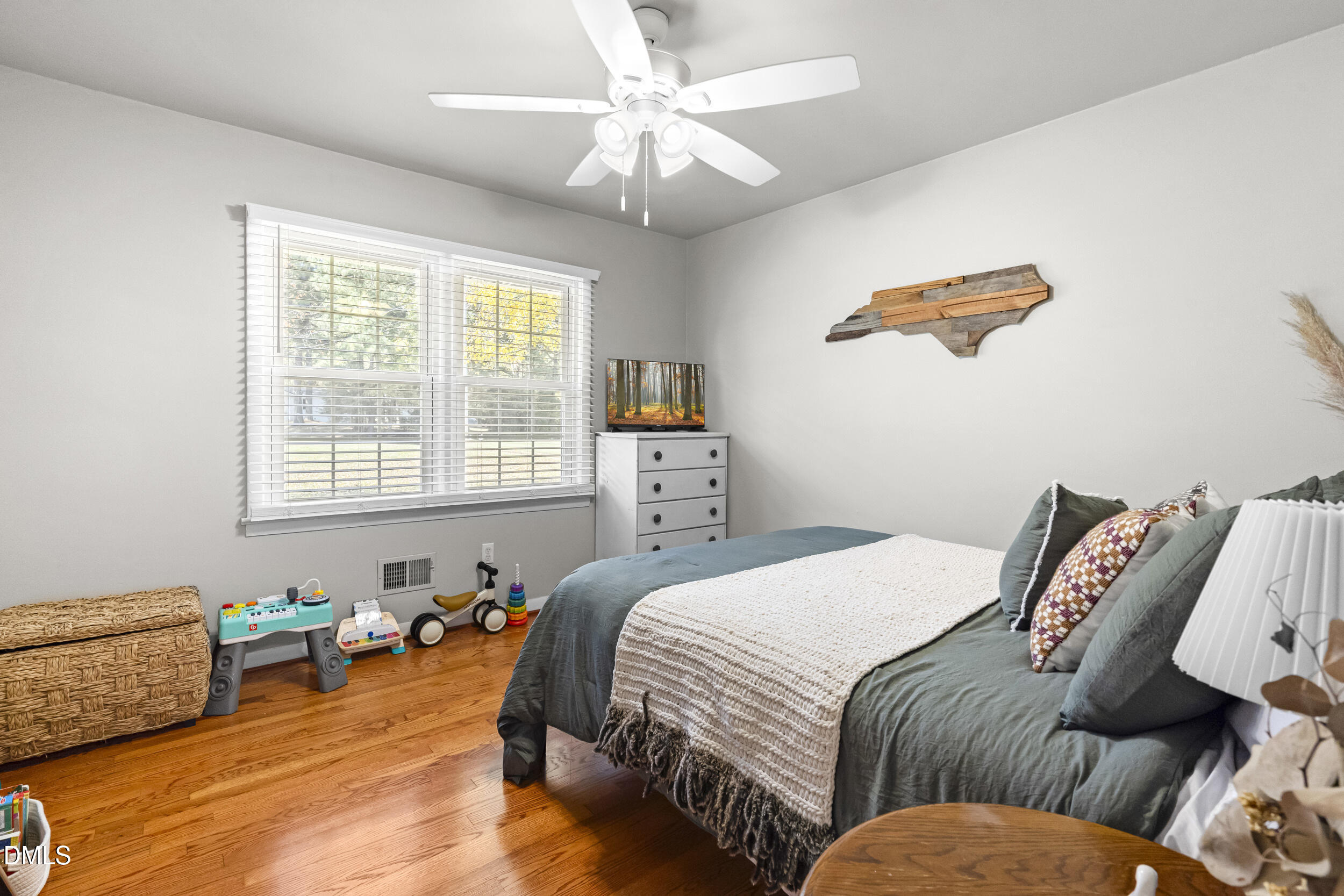 3032 Rosinburg Road Zebulon, NC 27597 - Photo 23 of 28 a bedroom with a bed and a couch