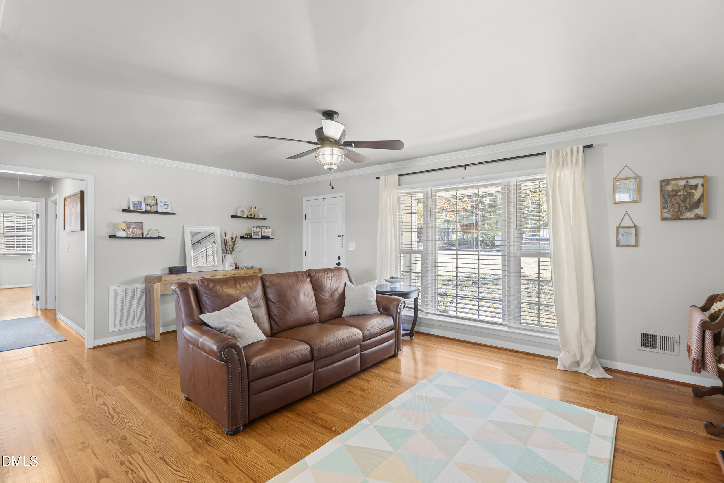 3032 Rosinburg Road Zebulon, NC 27597 - Photo 6 of 28 a living room with furniture and wooden floor