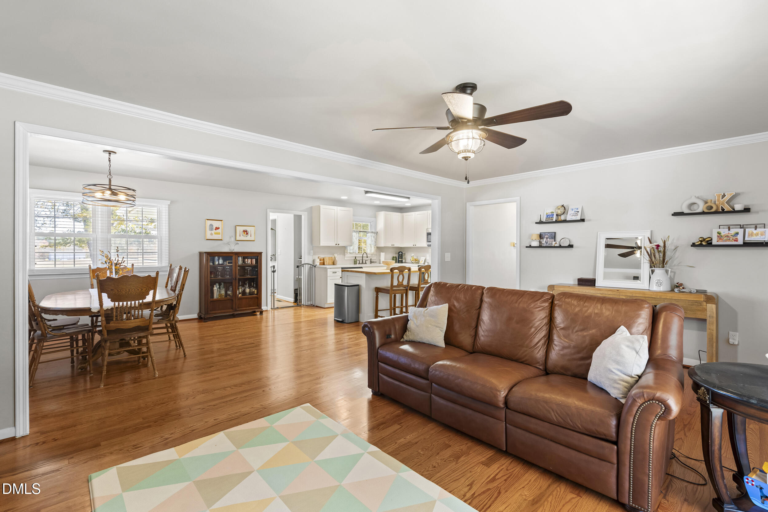 3032 Rosinburg Road Zebulon, NC 27597 - Photo 7 of 28 a living room with furniture and kitchen view