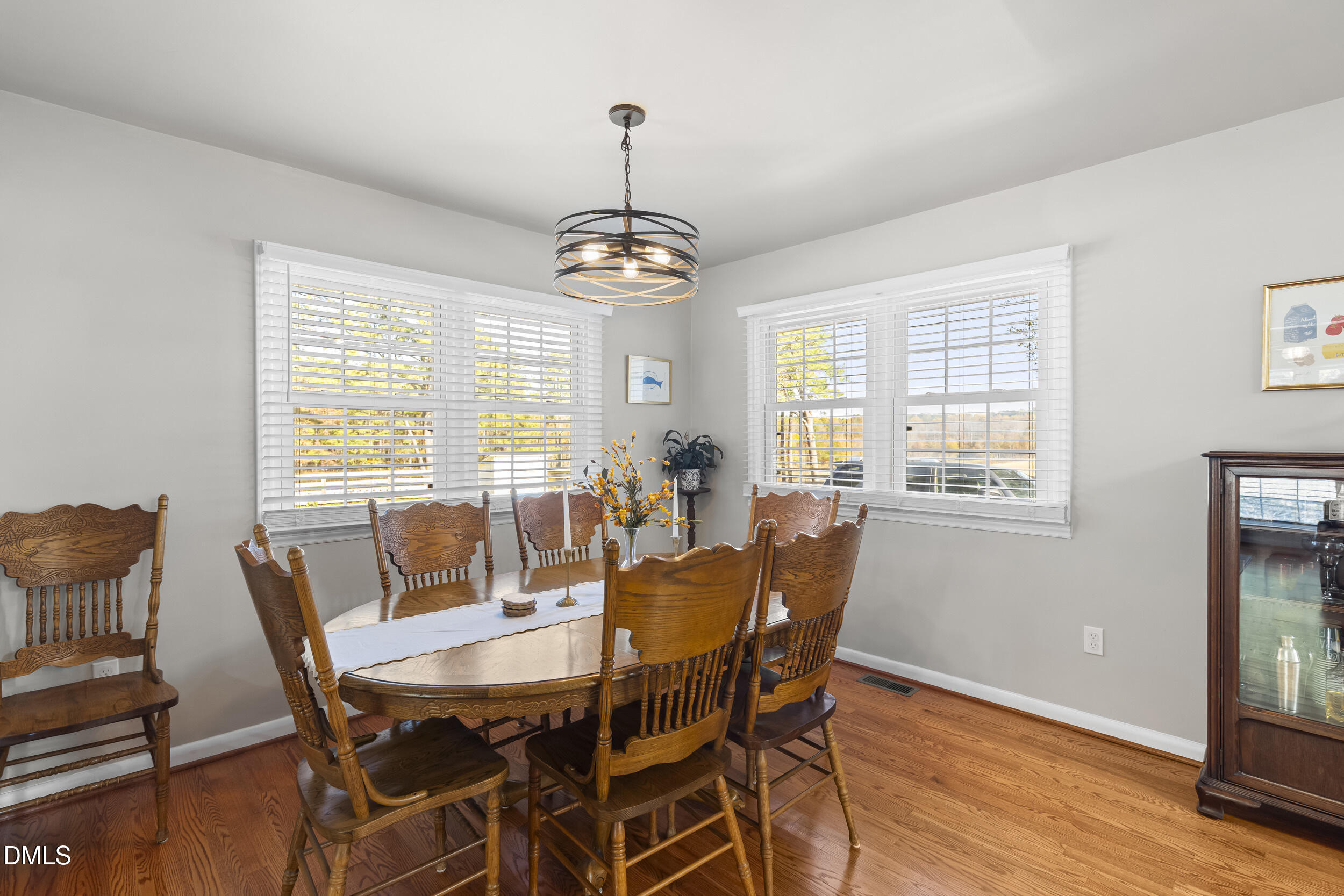3032 Rosinburg Road Zebulon, NC 27597 - Photo 8 of 28 a view of a dining room with furniture window and wooden floor