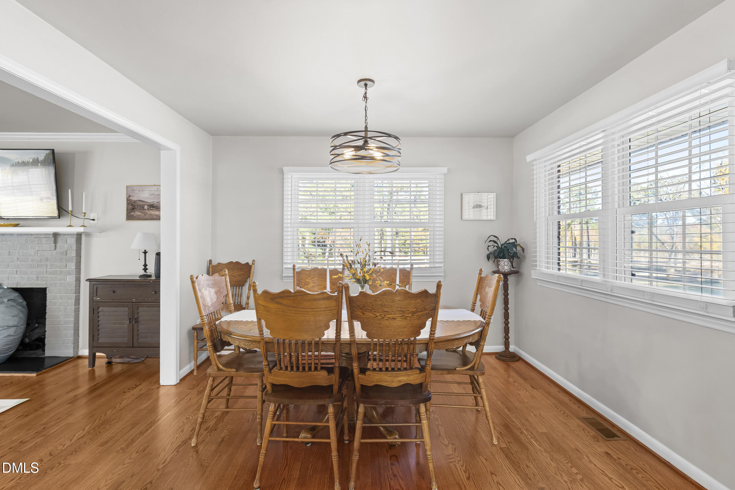 3032 Rosinburg Road Zebulon, NC 27597 - Photo 9 of 28 a view of a dining room with furniture window and wooden floor