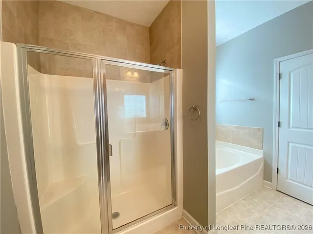 a bathroom with a glass shower door