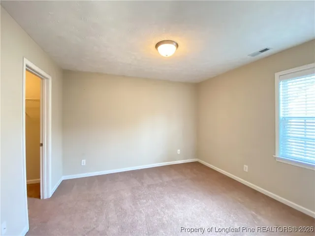 a white toilet sitting next to a bath tub