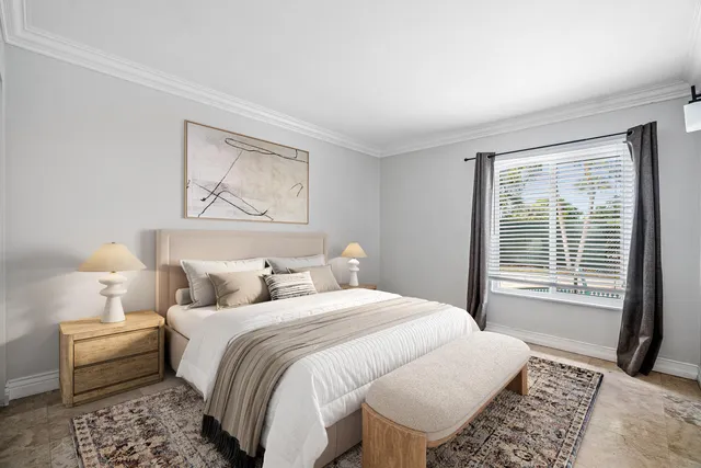 a bedroom with a bed and a couch