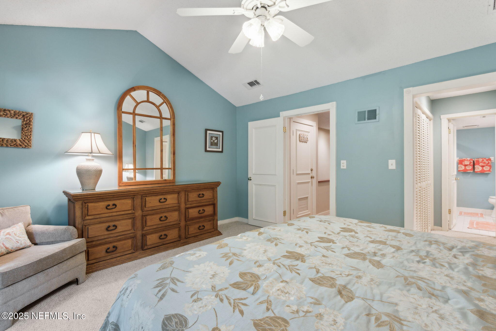 3028 Sea Marsh Road Fernandina Beach, FL 32034 - Photo 16 of 39 a bedroom with a bed and a dresser