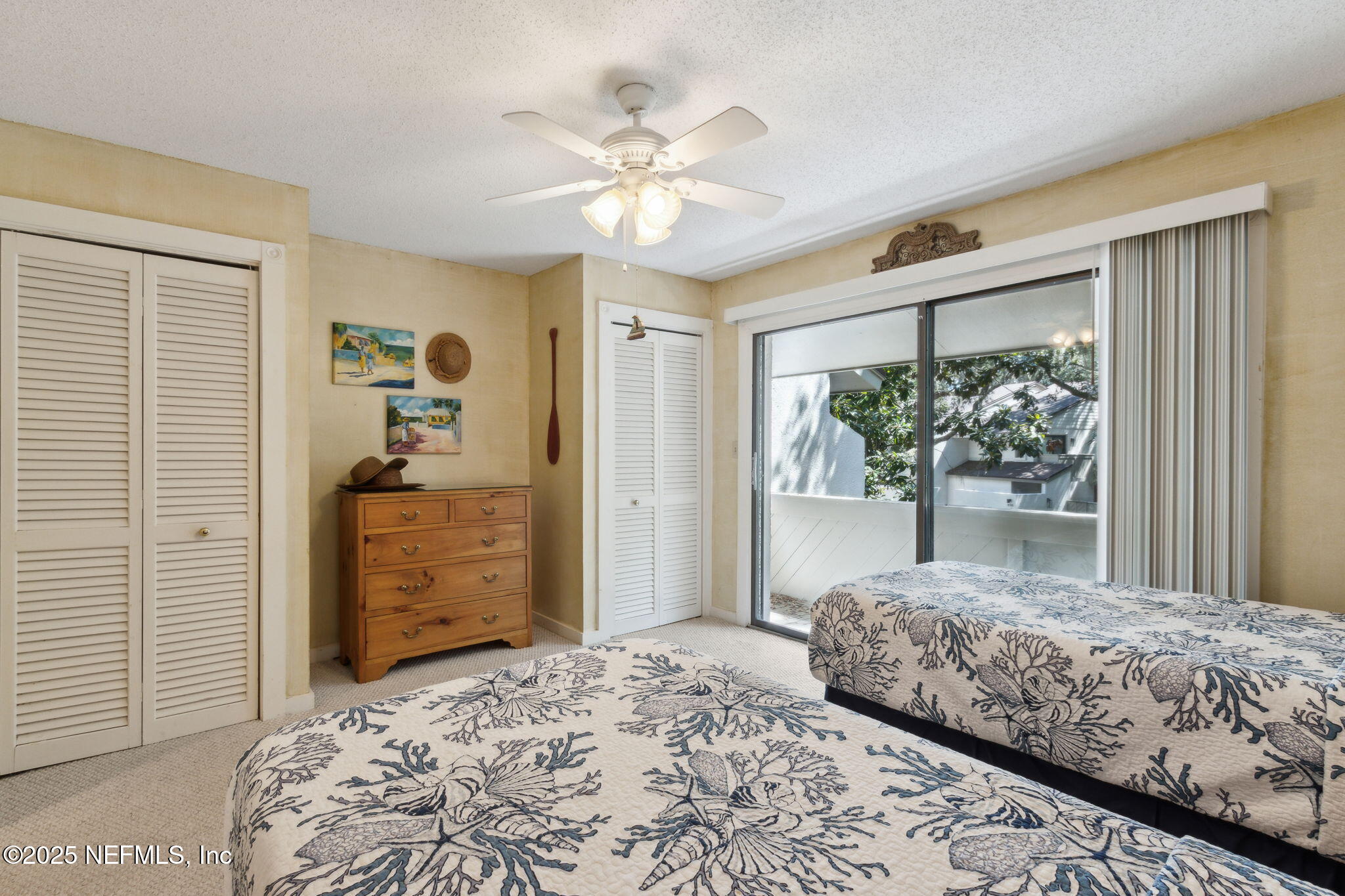 3028 Sea Marsh Road Fernandina Beach, FL 32034 - Photo 19 of 39 a bedroom with a bed and a dresser