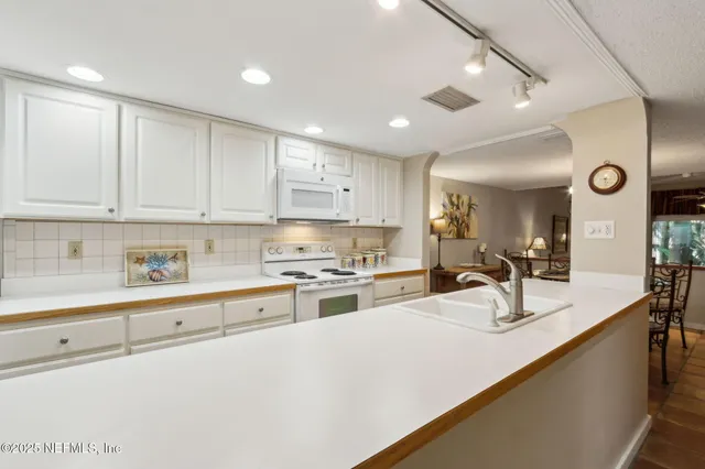 a wooden bench sitting in front of a building