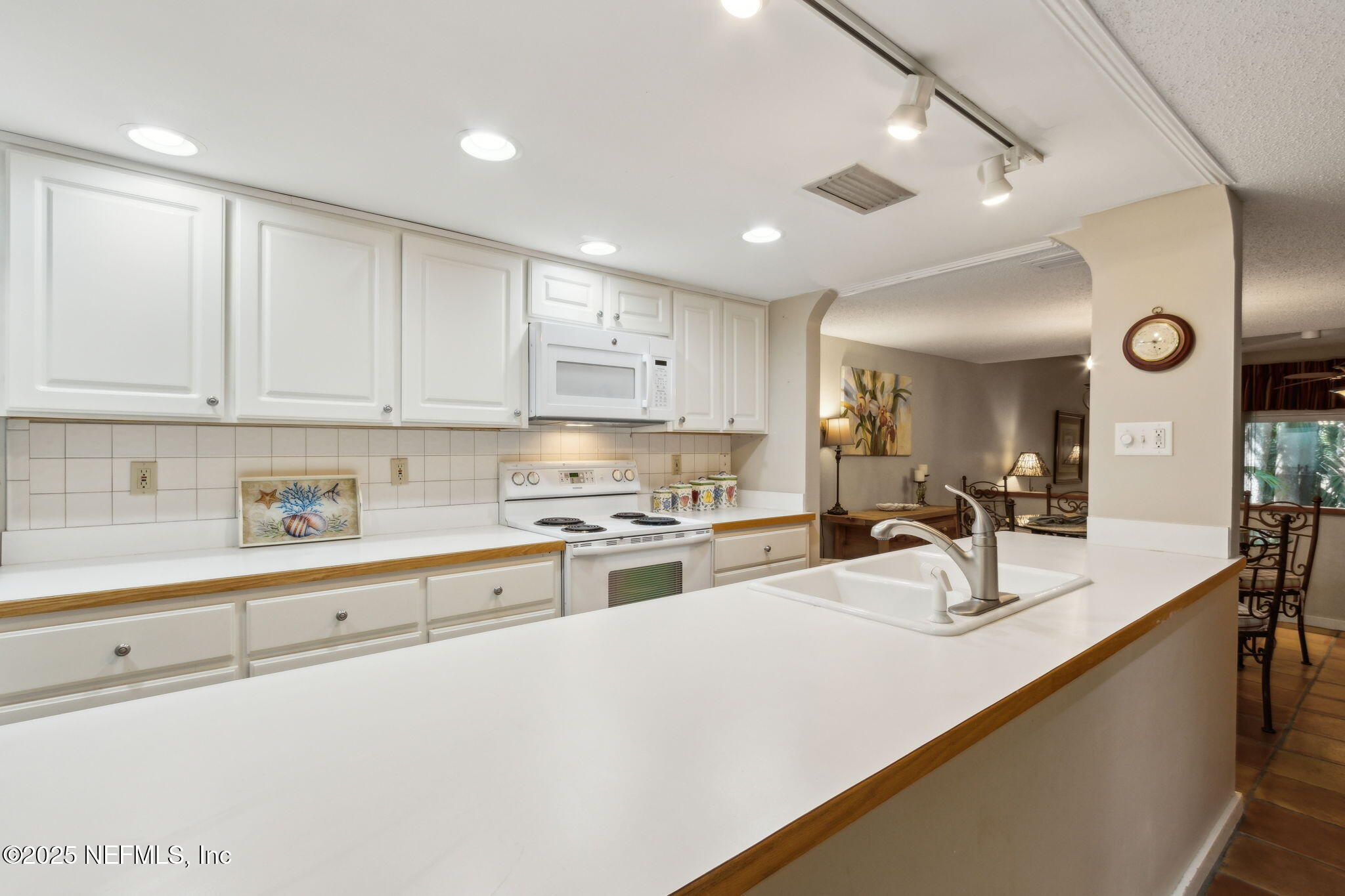 3028 Sea Marsh Road Fernandina Beach, FL 32034 - Photo 2 of 39 a kitchen with stainless steel appliances granite countertop a sink and cabinets