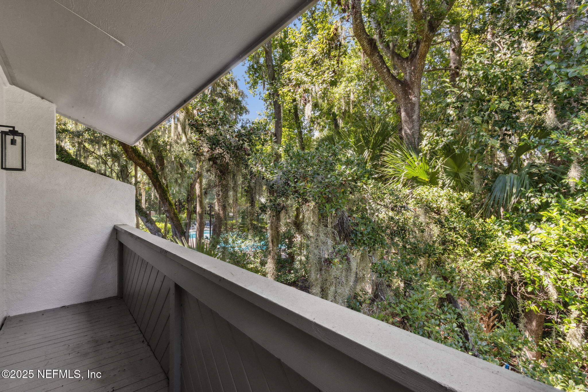 3028 Sea Marsh Road Fernandina Beach, FL 32034 - Photo 3 of 39 a wooden bench sitting in front of a building