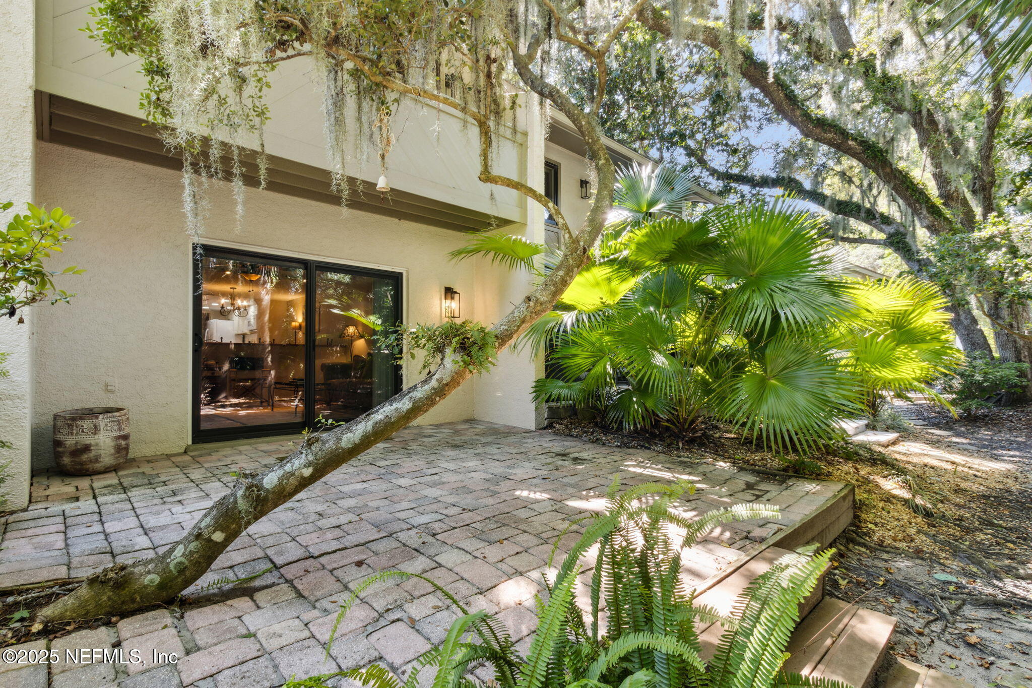 3028 Sea Marsh Road Fernandina Beach, FL 32034 - Photo 4 of 39 a view of a house with potted plants in front of door