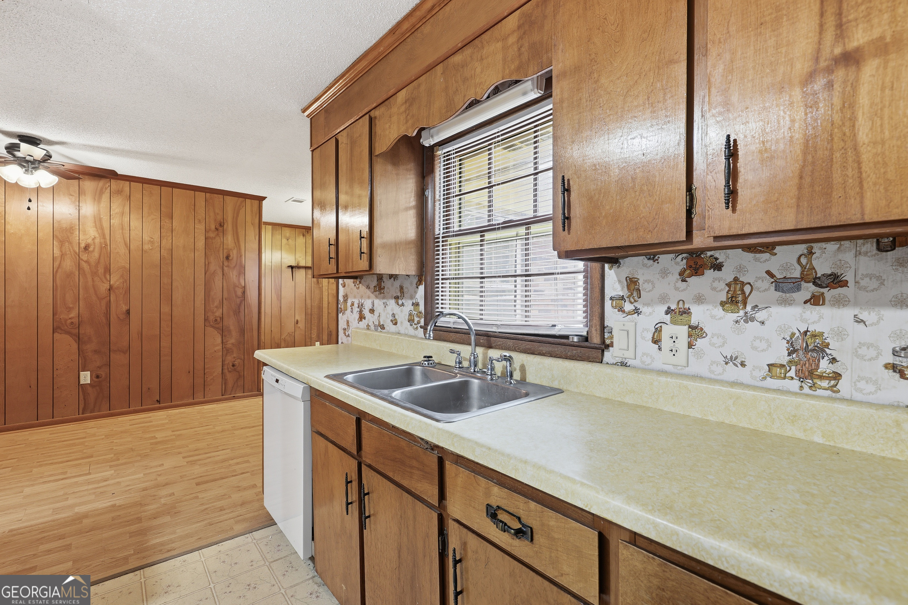 4 Forest Avenue Portal, GA 30450 - Photo 11 of 23 a kitchen with granite countertop a sink and a wooden floor