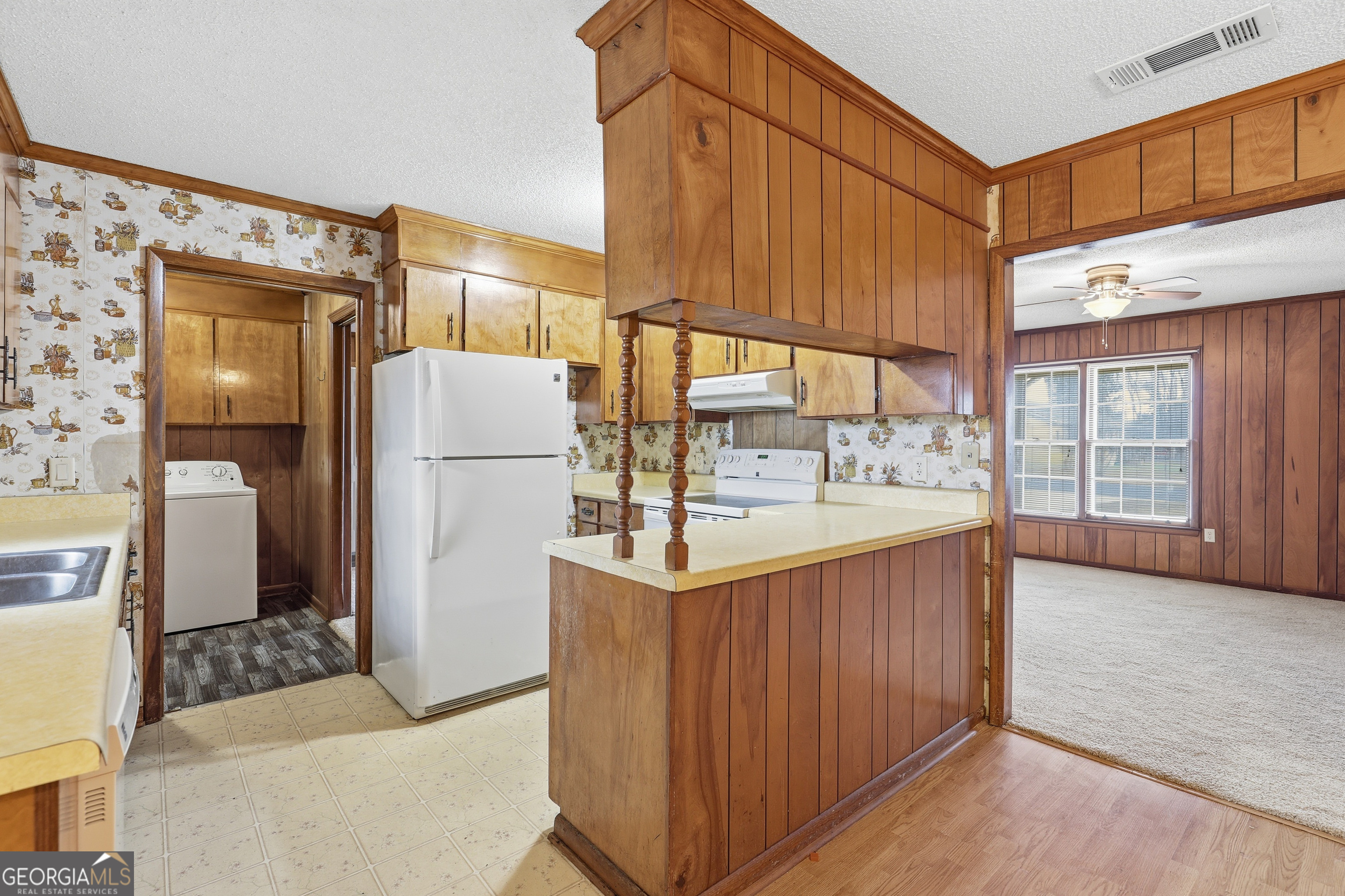 4 Forest Avenue Portal, GA 30450 - Photo 13 of 23 a kitchen with refrigerator and cabinets