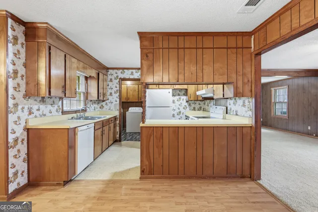 a bathroom with a double vanity sink mirror and shower