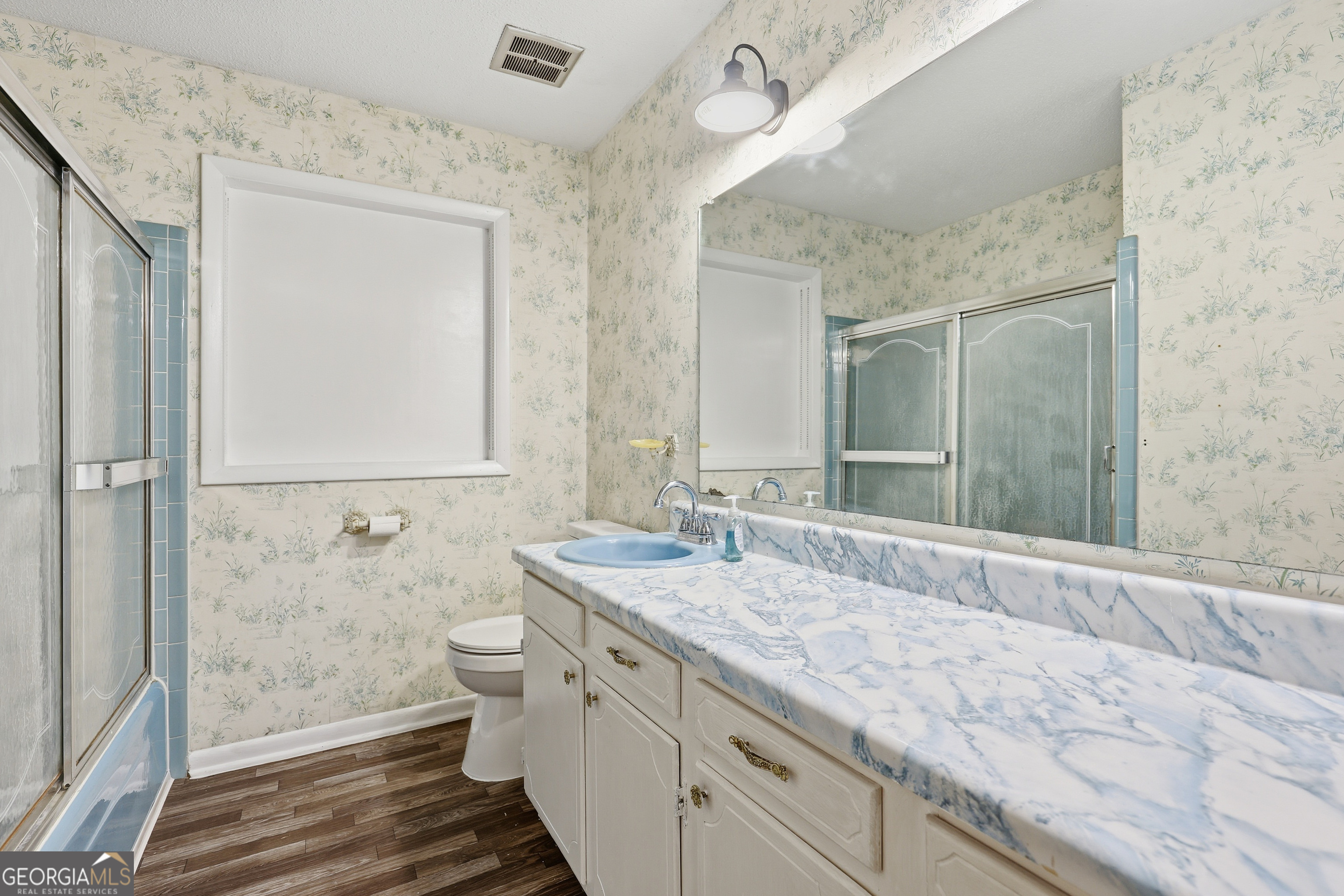 4 Forest Avenue Portal, GA 30450 - Photo 18 of 23 a bathroom with a granite countertop sink toilet and shower