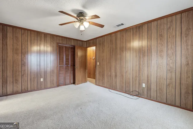 a bathroom with a double vanity sink mirror and shower