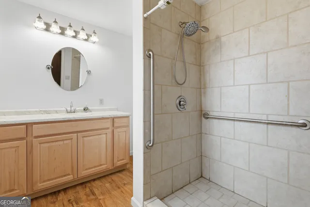 a bathroom with a sink a vanity and a mirror