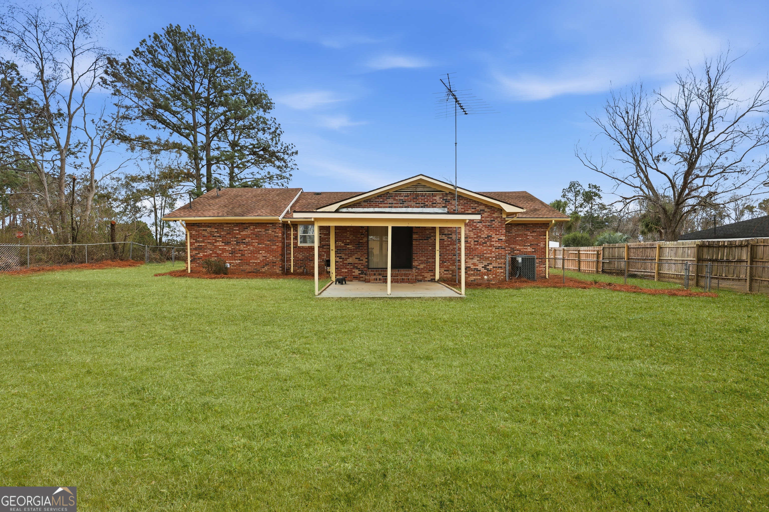 4 Forest Avenue Portal, GA 30450 - Photo 4 of 23 a front view of a house with a garden
