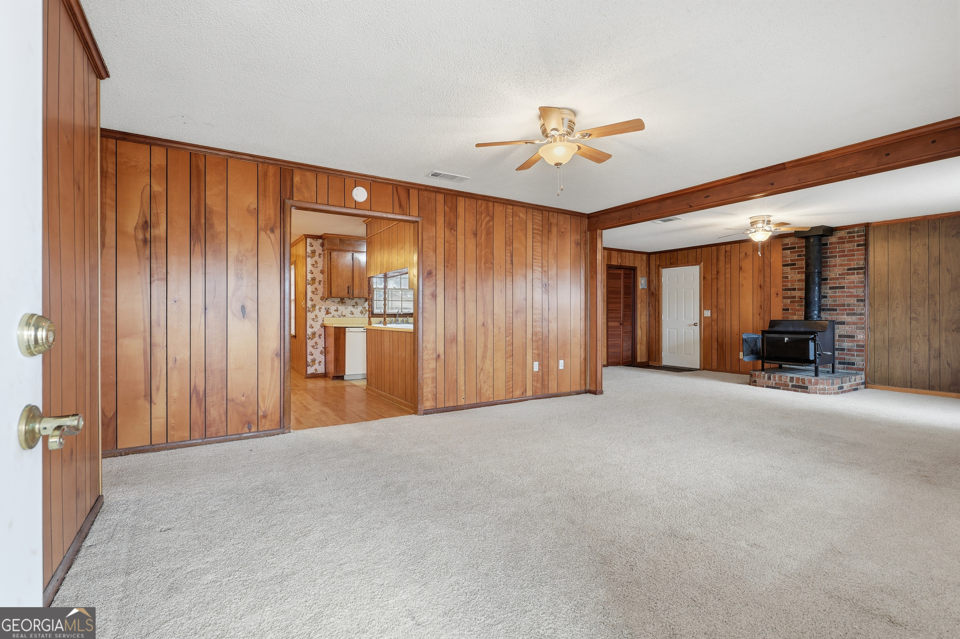 4 Forest Avenue Portal, GA 30450 - Photo 6 of 23 a view of a livingroom with a chandelier fan and a large window