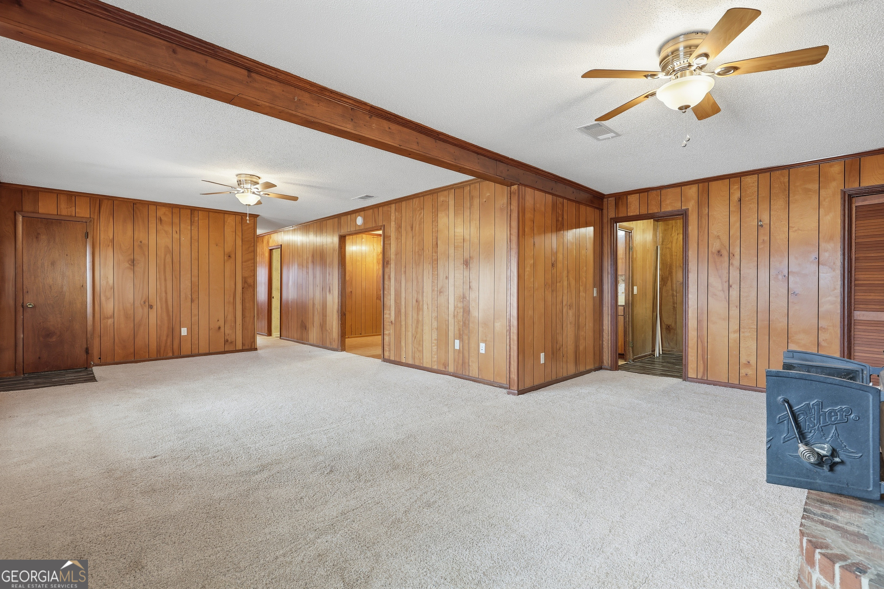 4 Forest Avenue Portal, GA 30450 - Photo 9 of 23 a view of an empty room with a ceiling fan
