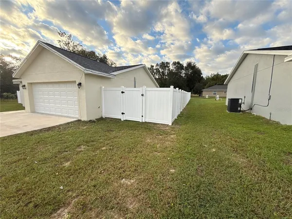 a view of a backyard of the house