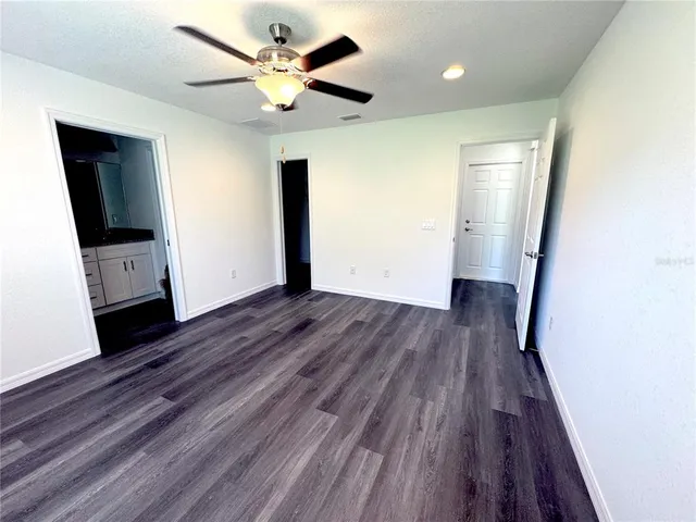 a view of livingroom with hardwood floor and a ceiling fan