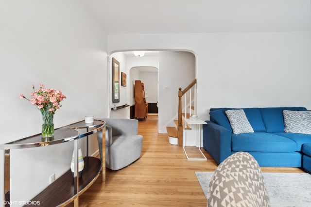 a living room with furniture flowerpot and a potted plant